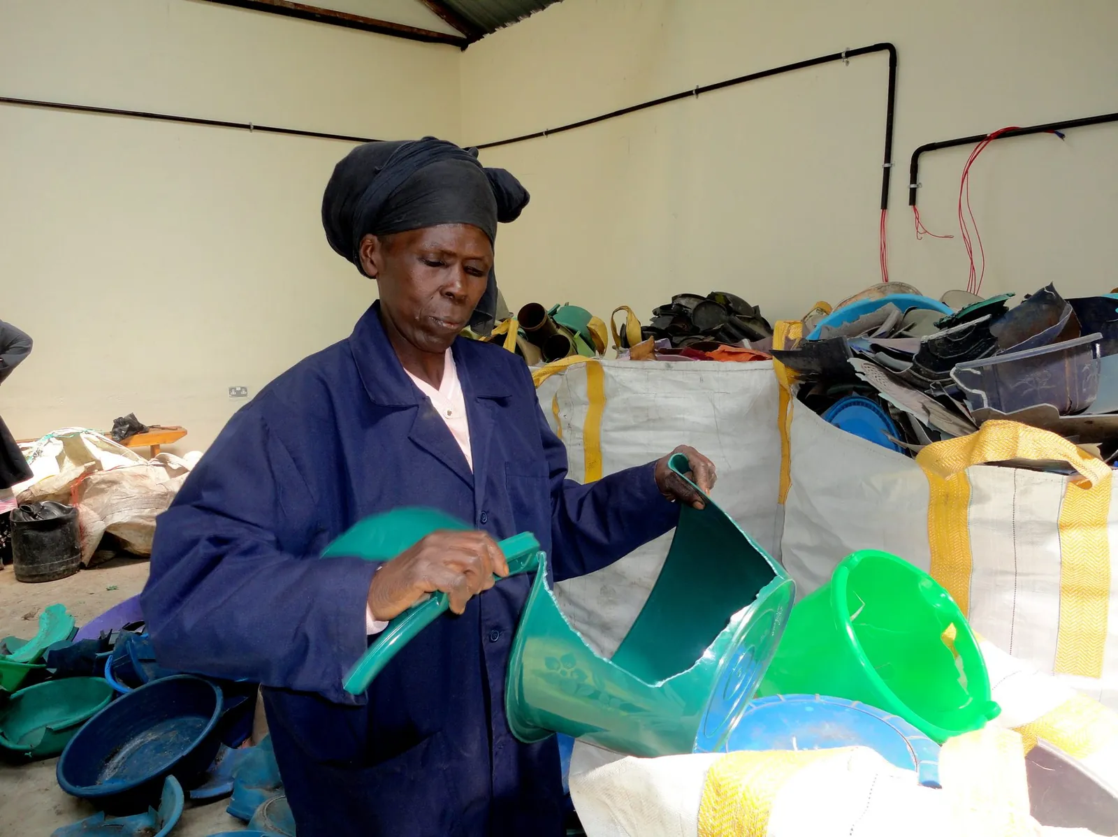 Workers sorting recyclable material on a conveyor