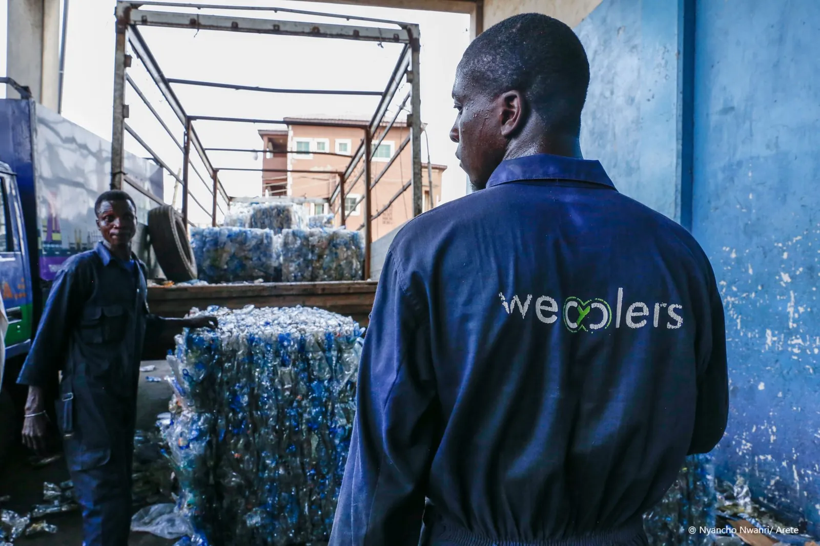 Baled plastic being loaded onto a truck for delivery to a recycler
